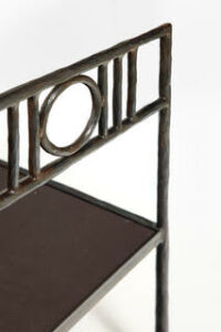 Close up of a single daybed in brown wrought iron by Garouste Bonetti