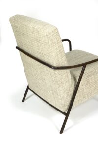 Back of the white Agathe armchair by Eric Jourdan, white fabric, structure in wrought brown wrought iron with curves