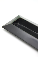 Close-up of the black bronze pencil case by Andrée Putman, famous French designer